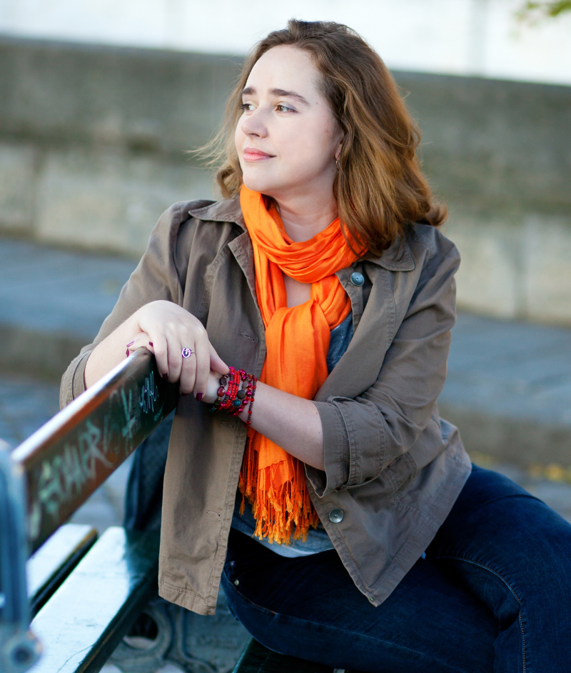 A woman looking over a bridge
